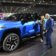 U.S. President Joe Biden and GM CEO Mary Barra look at a Chevrolet Silverado EV at NAIAS.